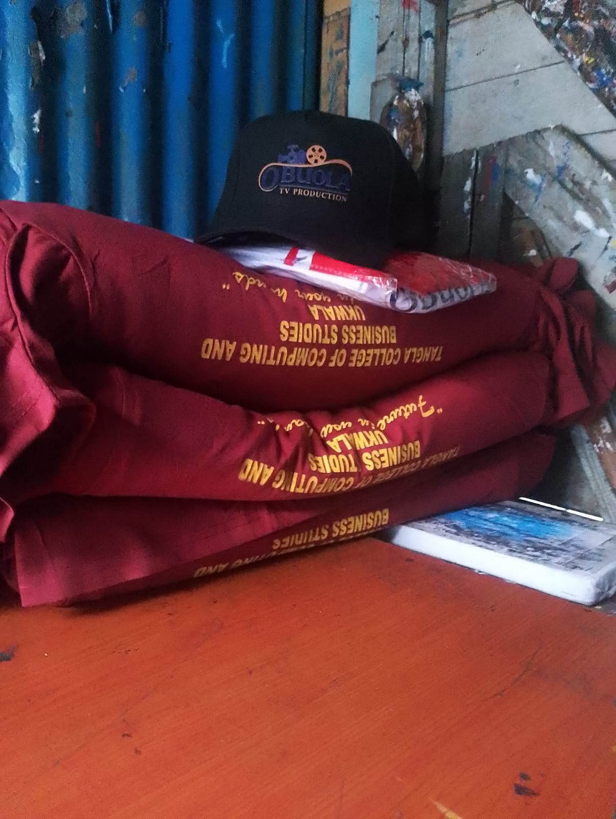 Obuola TV branded T-shirts and cap