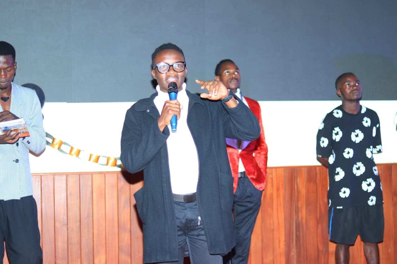 Obuola TV MC hosting event on stage